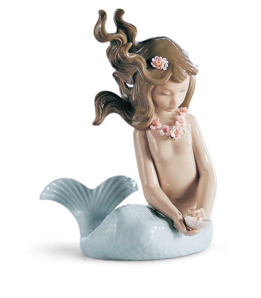 Sirena con brazos al costado